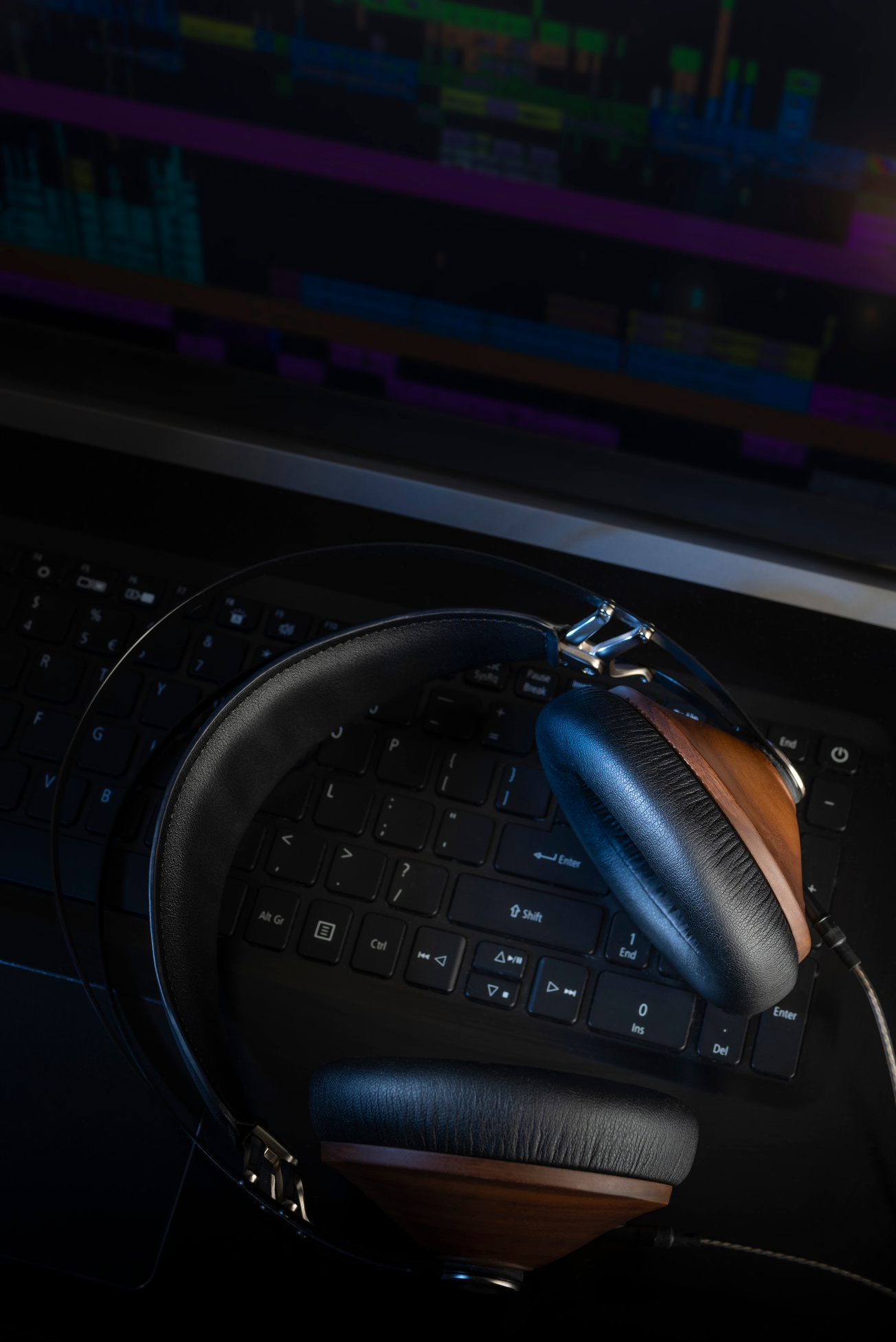 Hi-Fi headphones and computer in a home-studio audio recording and producing